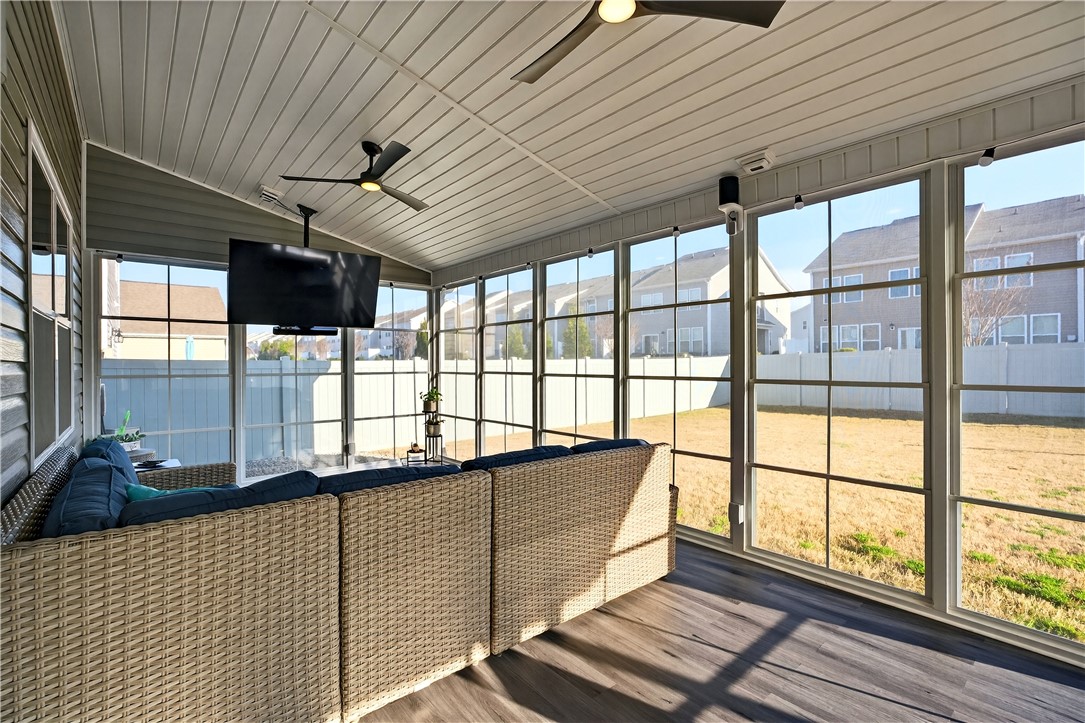 102 Preservation Drive Greer, SC 29650 - Photo 4 of 44 This bright sunroom offers expansive views and comfortable lounging, extending your living space outdoors.