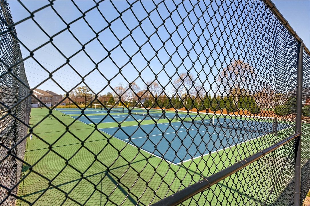 102 Preservation Drive Greer, SC 29650 - Photo 44 of 44 This community tennis court offers a vibrant space for active recreation and social engagement.