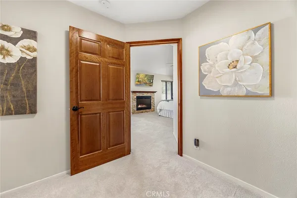 a bedroom with a bed and a fireplace