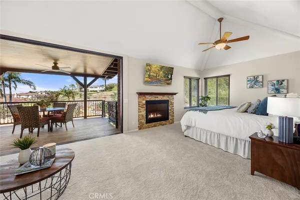 a living room with furniture a window and a fireplace