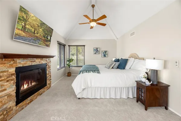 a large bathroom with a glass door shower and sink