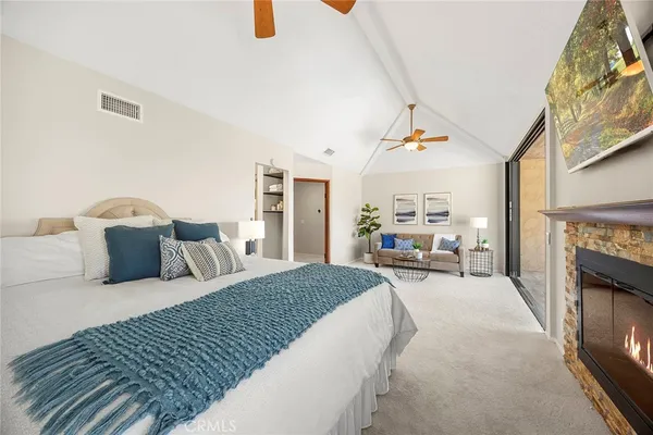 a spacious bathroom with a tub sink and mirror