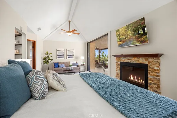 a large kitchen with stainless steel appliances kitchen island granite countertop a refrigerator and a sink