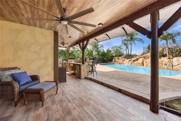a bathroom with a sink a mirror a toilet and bathtub