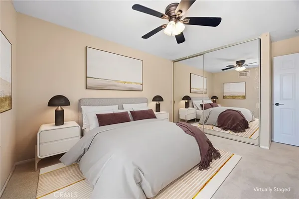 a view of a house with backyard and a patio