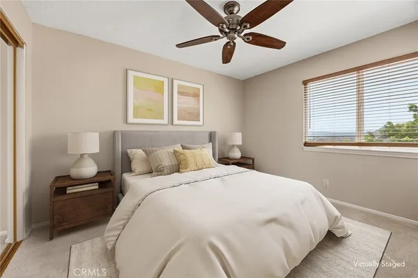 a outdoor space with lots of white furniture and a lawn chairs