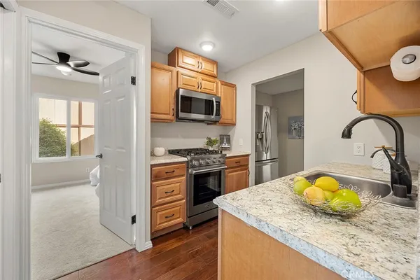 a kitchen with a sink a stove and refrigerator
