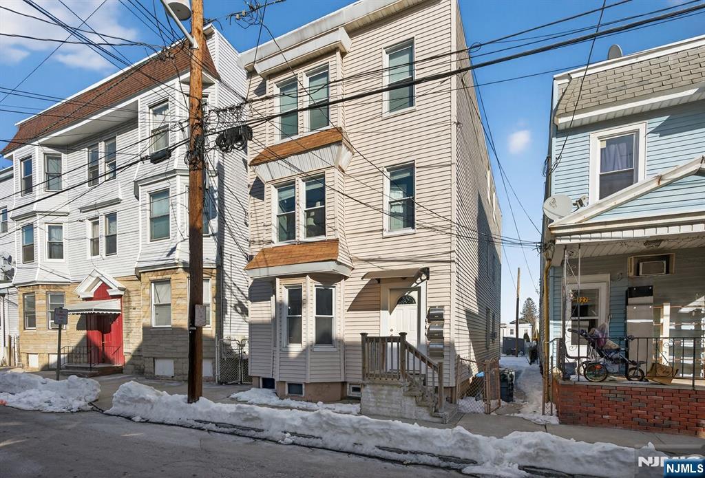 229 Patterson Street Harrison, NJ 07029 - Photo 1 of 25 a view of a brick building with many windows