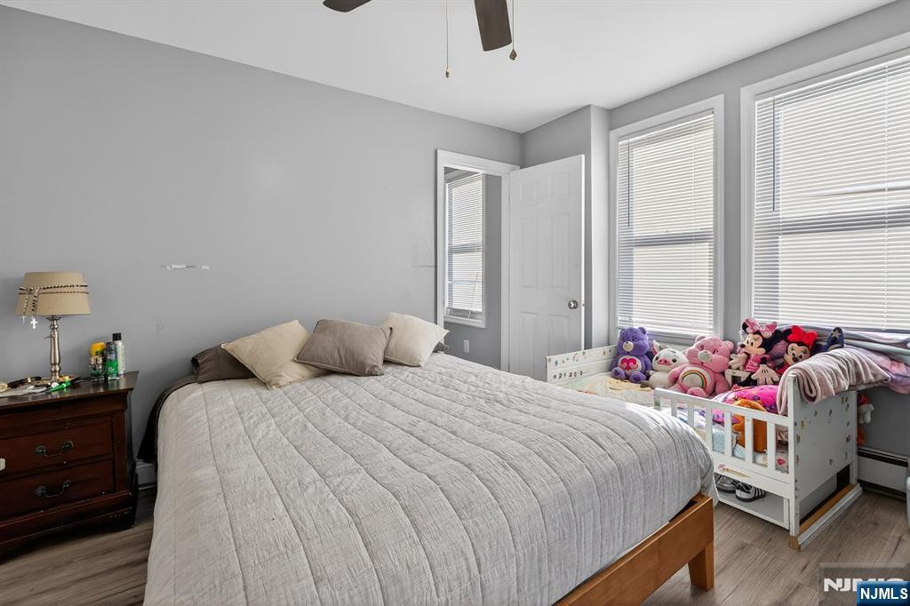 229 Patterson Street Harrison, NJ 07029 - Photo 19 of 25 a bedroom with bed and a large window
