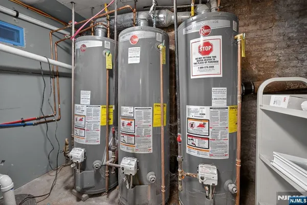 a street sign on a wall next to a building