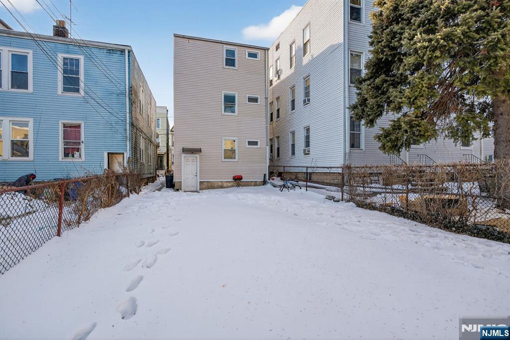 229 Patterson Street Harrison, NJ 07029 - Photo 24 of 25 a view of a house with a outdoor space