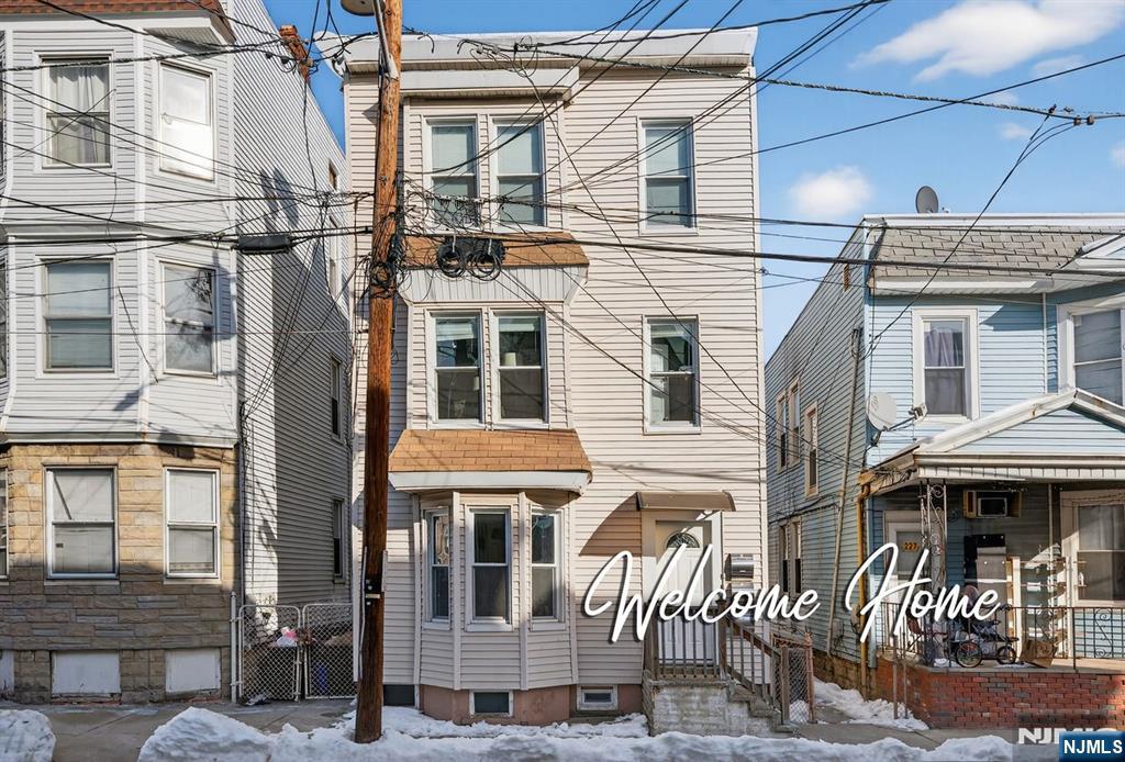 229 Patterson Street Harrison, NJ 07029 - Photo 25 of 25 a front view of a building with glass windows