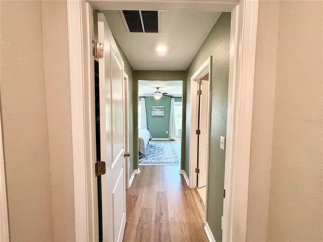 a view of gallery with wooden floor