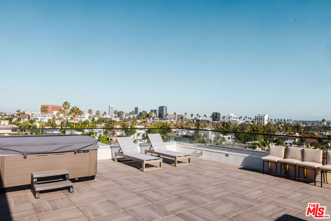 411 South Hamel Road, Unit 401 Los Angeles, CA 90048 - Photo 13 of 19 a view of a terrace with chairs