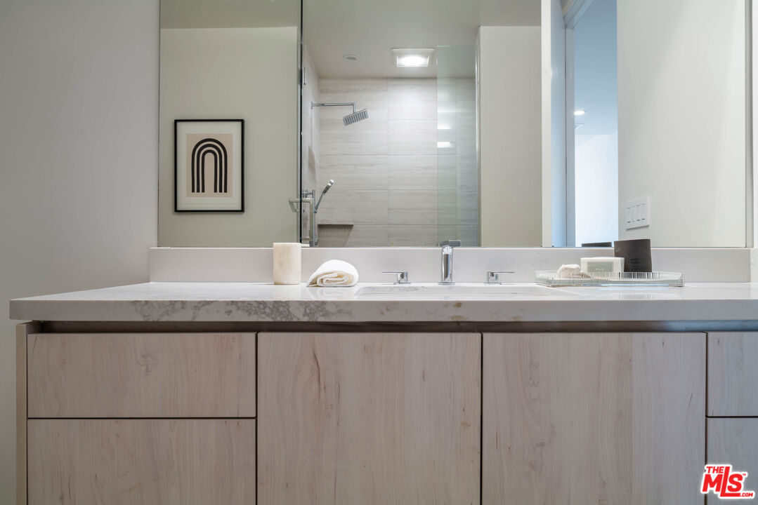 411 South Hamel Road, Unit 401 Los Angeles, CA 90048 - Photo 14 of 19 a bathroom with a sink and a mirror