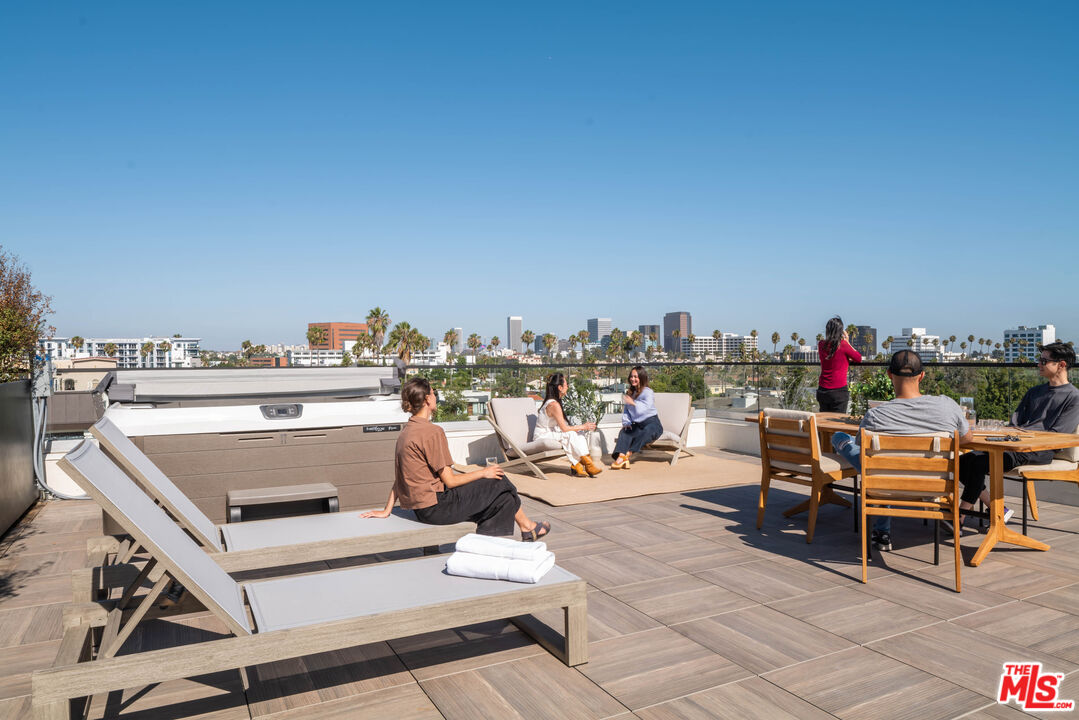 411 South Hamel Road, Unit 401 Los Angeles, CA 90048 - Photo 2 of 19 a view of a chairs and table in a terrace