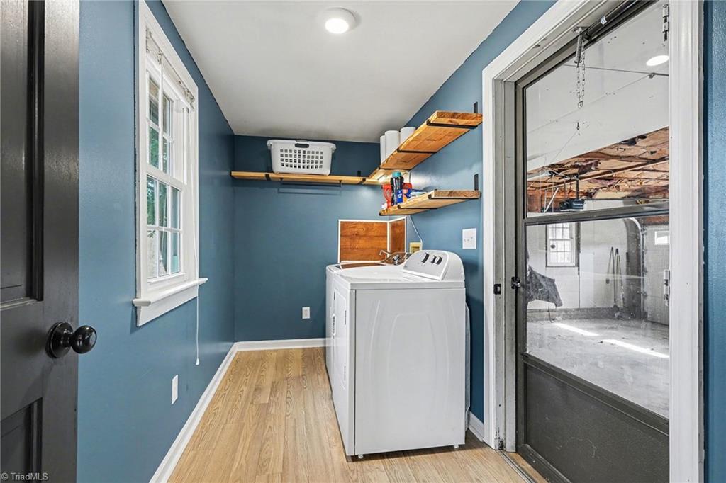 391 Link Road Reidsville, NC 27320 - Photo 26 of 37 oversized laundry room with utility sink and shelving right off the garage