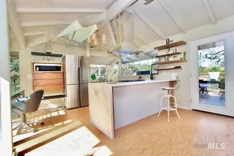 a view of a dining room with furniture wooden floor and chandelier