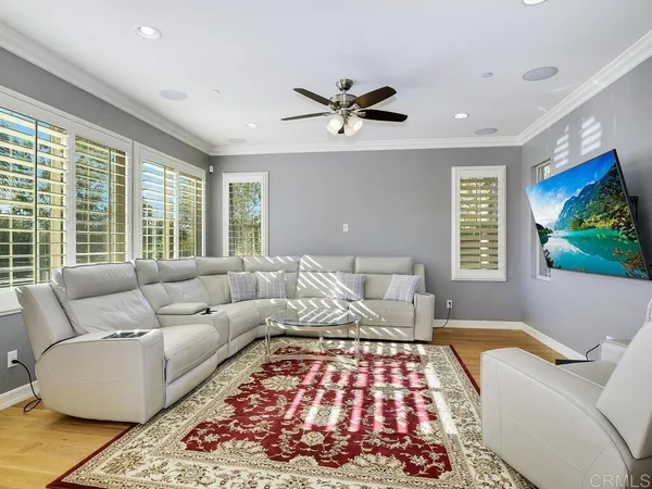 a living room with a couch and a window