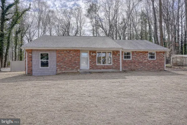 front view of a house with a dry yard