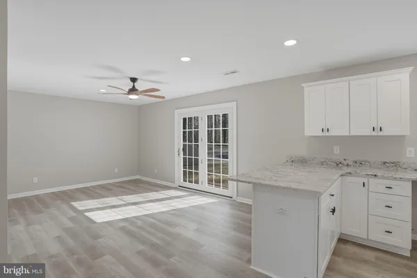 a view of a kitchen with a sink cabinets and window