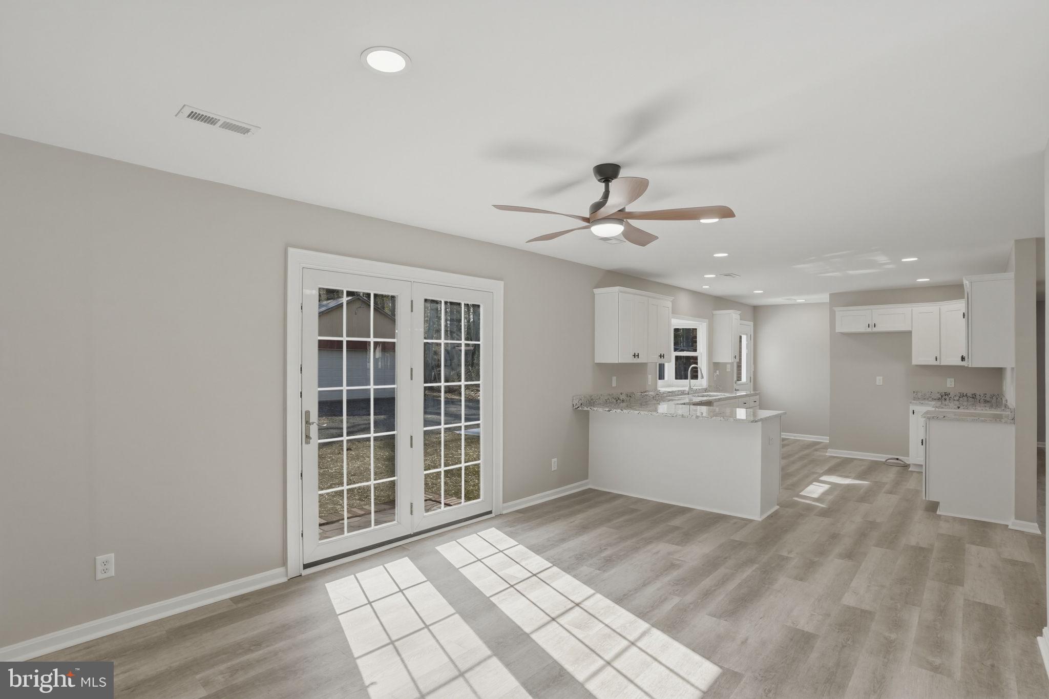 3250 Andrews Lake Road Felton, DE 19943 - Photo 15 of 45 a view of a kitchen with a sink cabinets and window