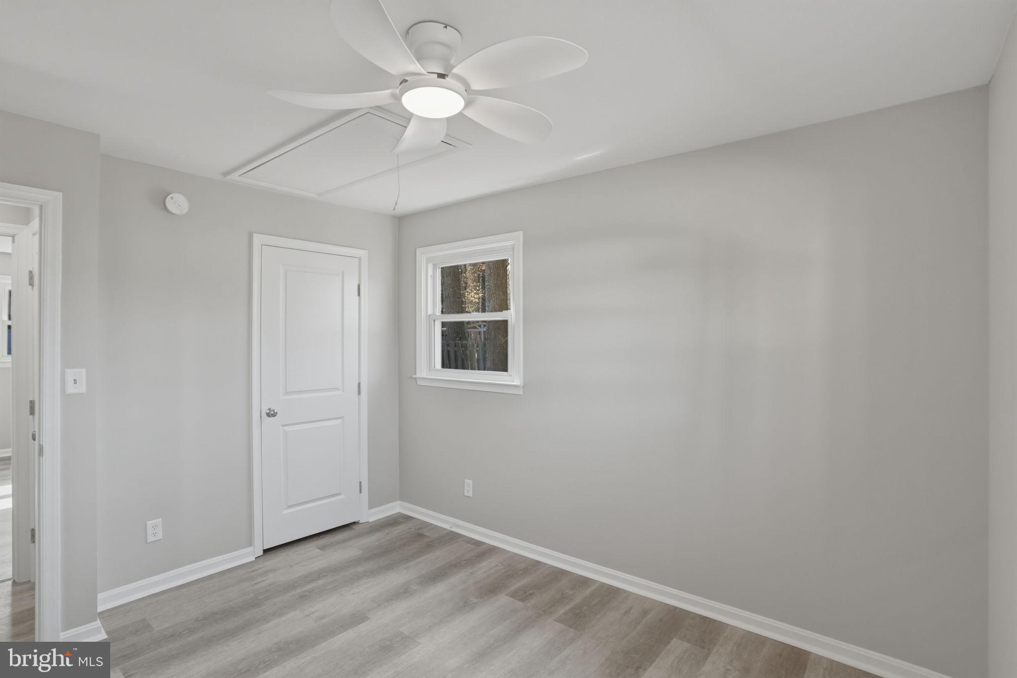 3250 Andrews Lake Road Felton, DE 19943 - Photo 27 of 45 an empty room with a ceiling fan and a window