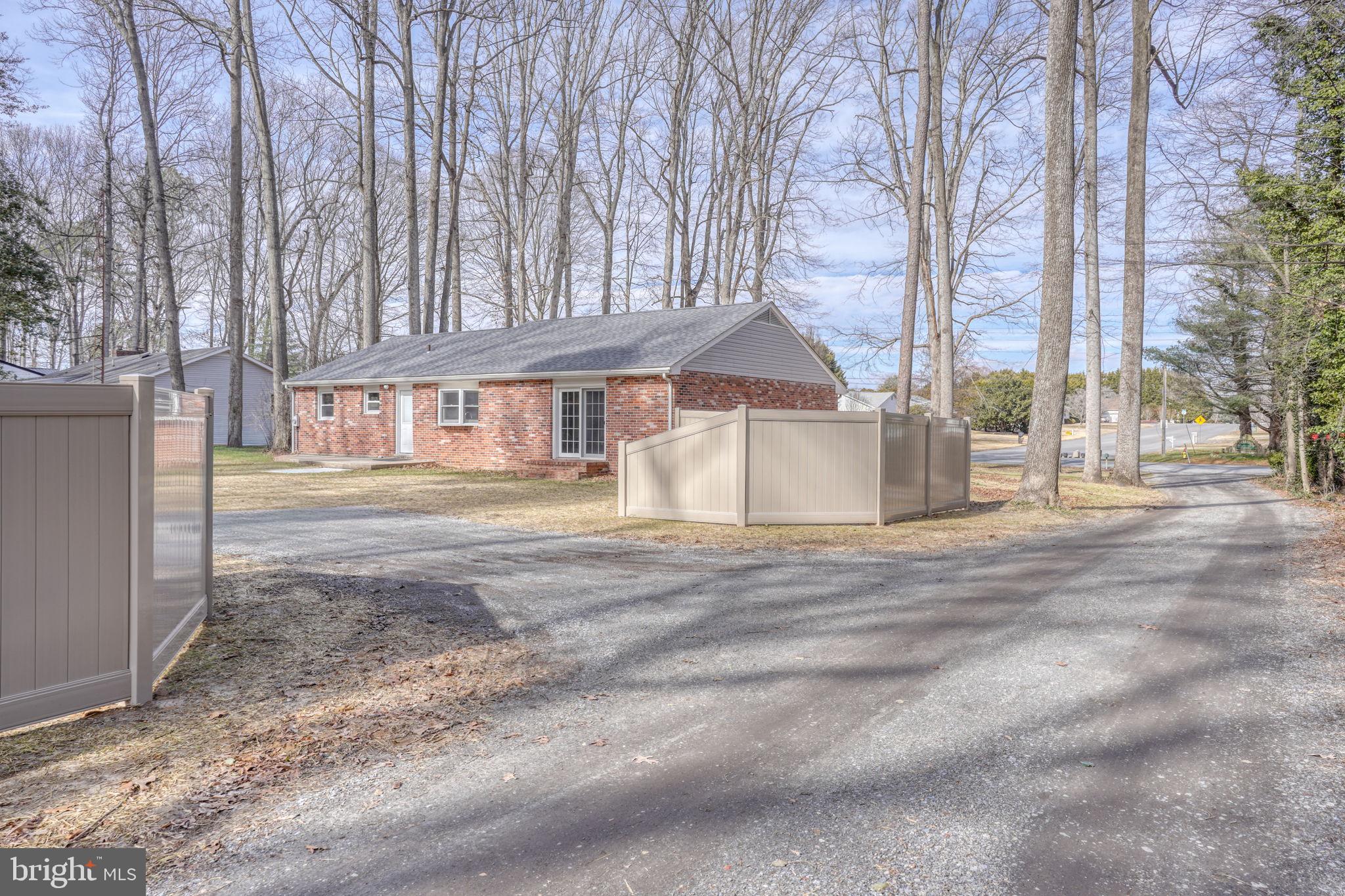 3250 Andrews Lake Road Felton, DE 19943 - Photo 7 of 45 a front view of a house with a yard