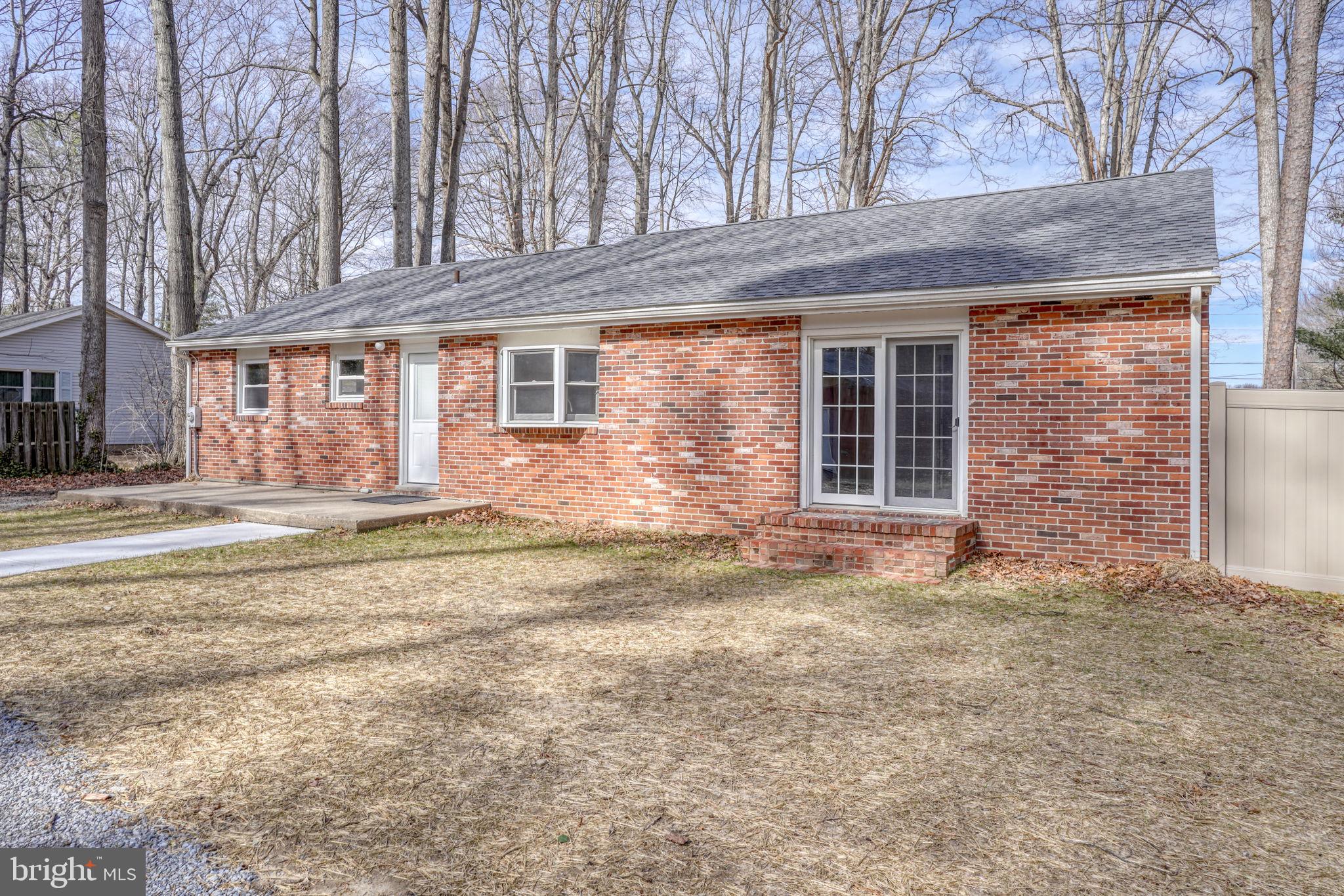 3250 Andrews Lake Road Felton, DE 19943 - Photo 8 of 45 a front view of a house with a garden