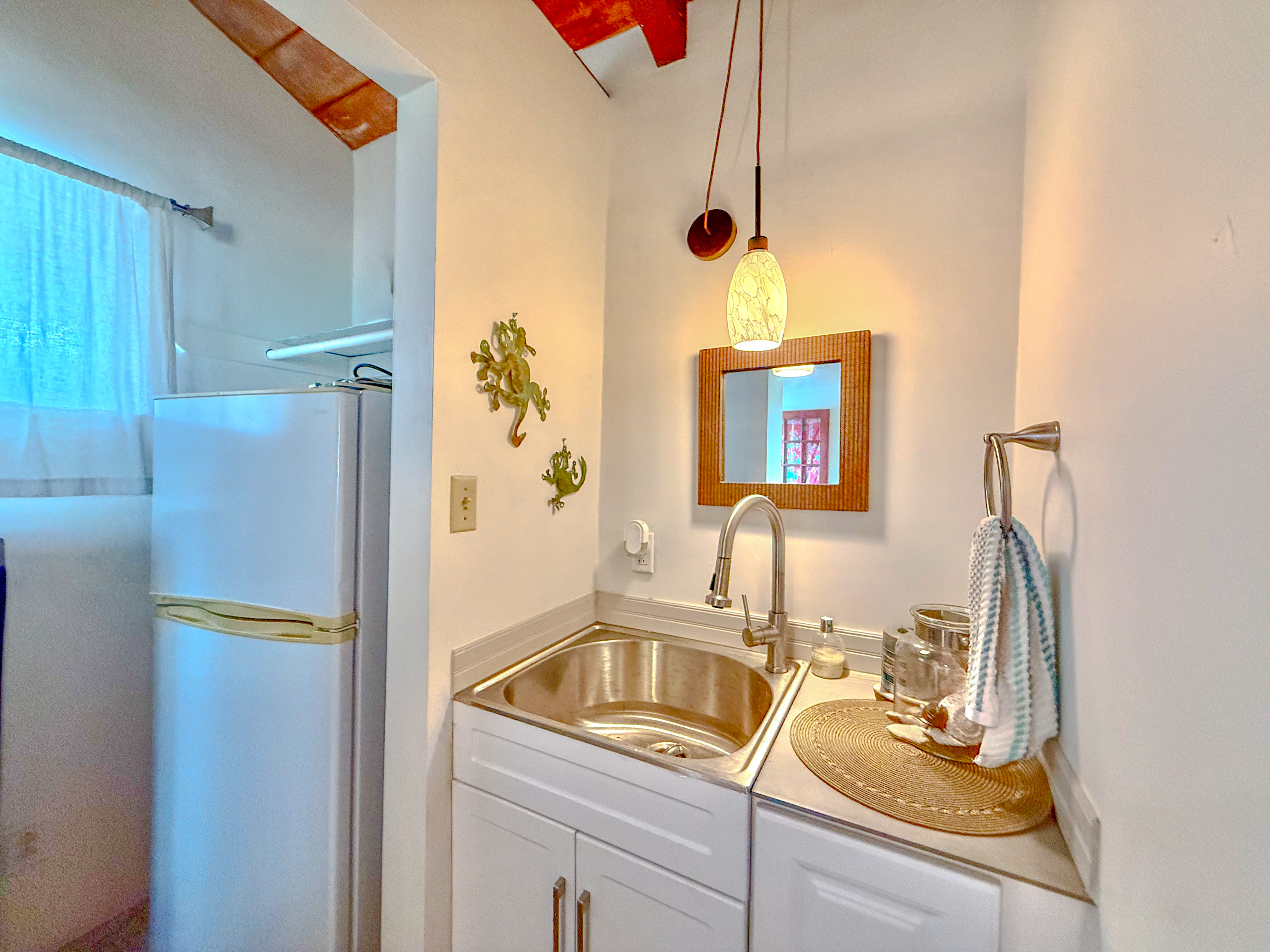 94-1726 Wakea Avenue Naalehu, HI 96772 - Photo 17 of 30 a bathroom with a sink and a mirror