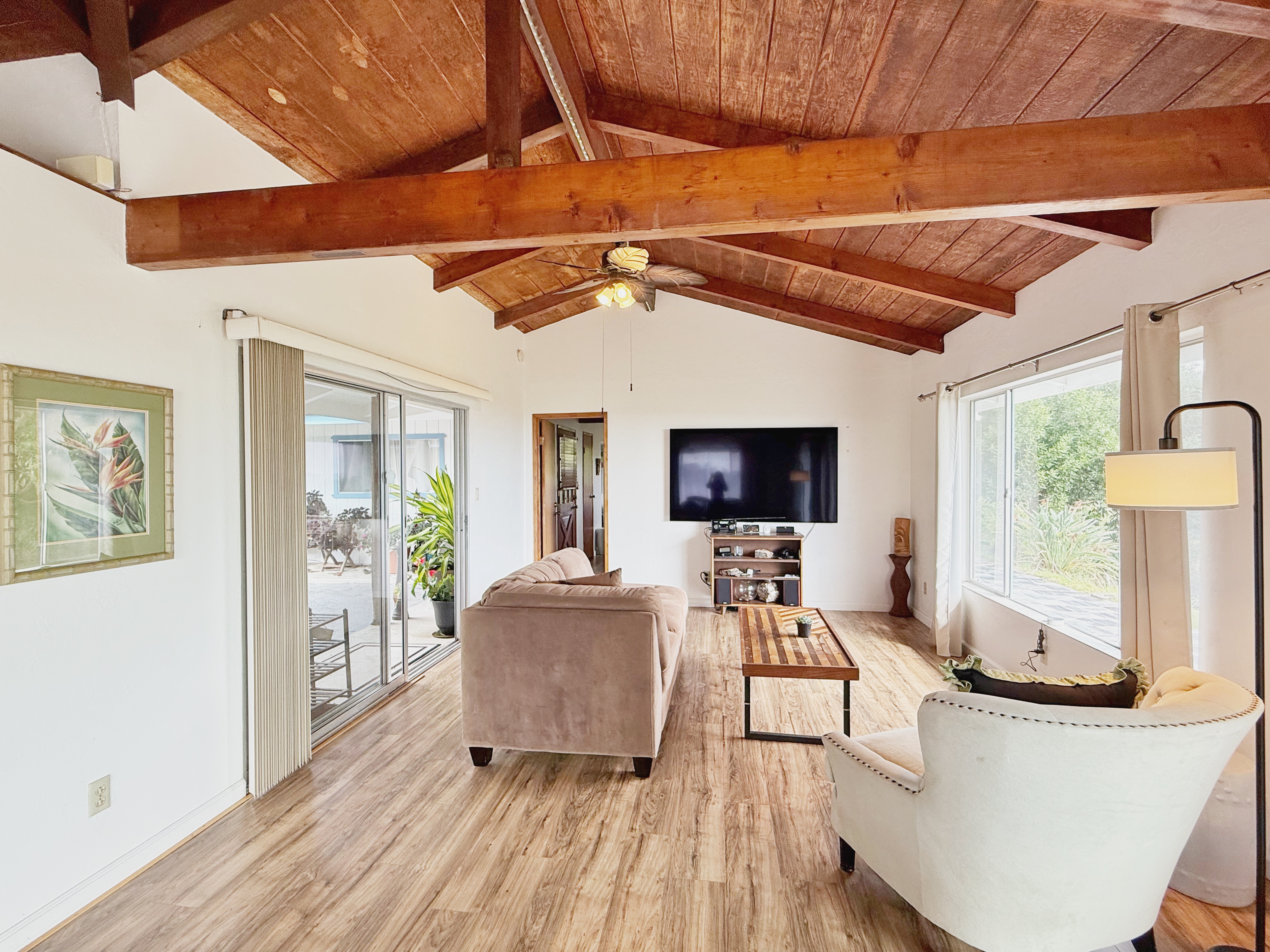 94-1726 Wakea Avenue Naalehu, HI 96772 - Photo 4 of 30 a living room with furniture and a flat screen tv