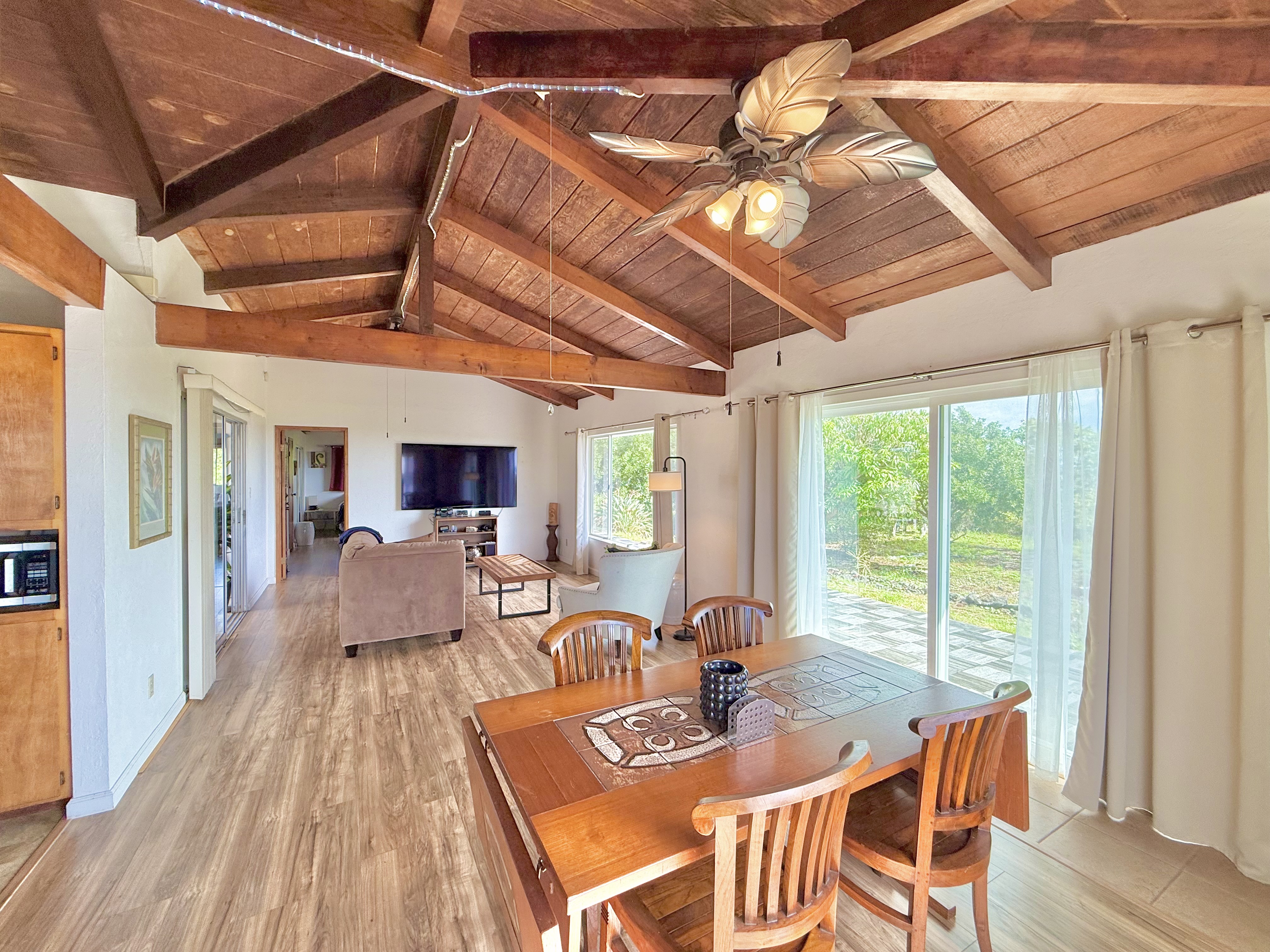 94-1726 Wakea Avenue Naalehu, HI 96772 - Photo 5 of 30 a dining room with furniture and wooden floor