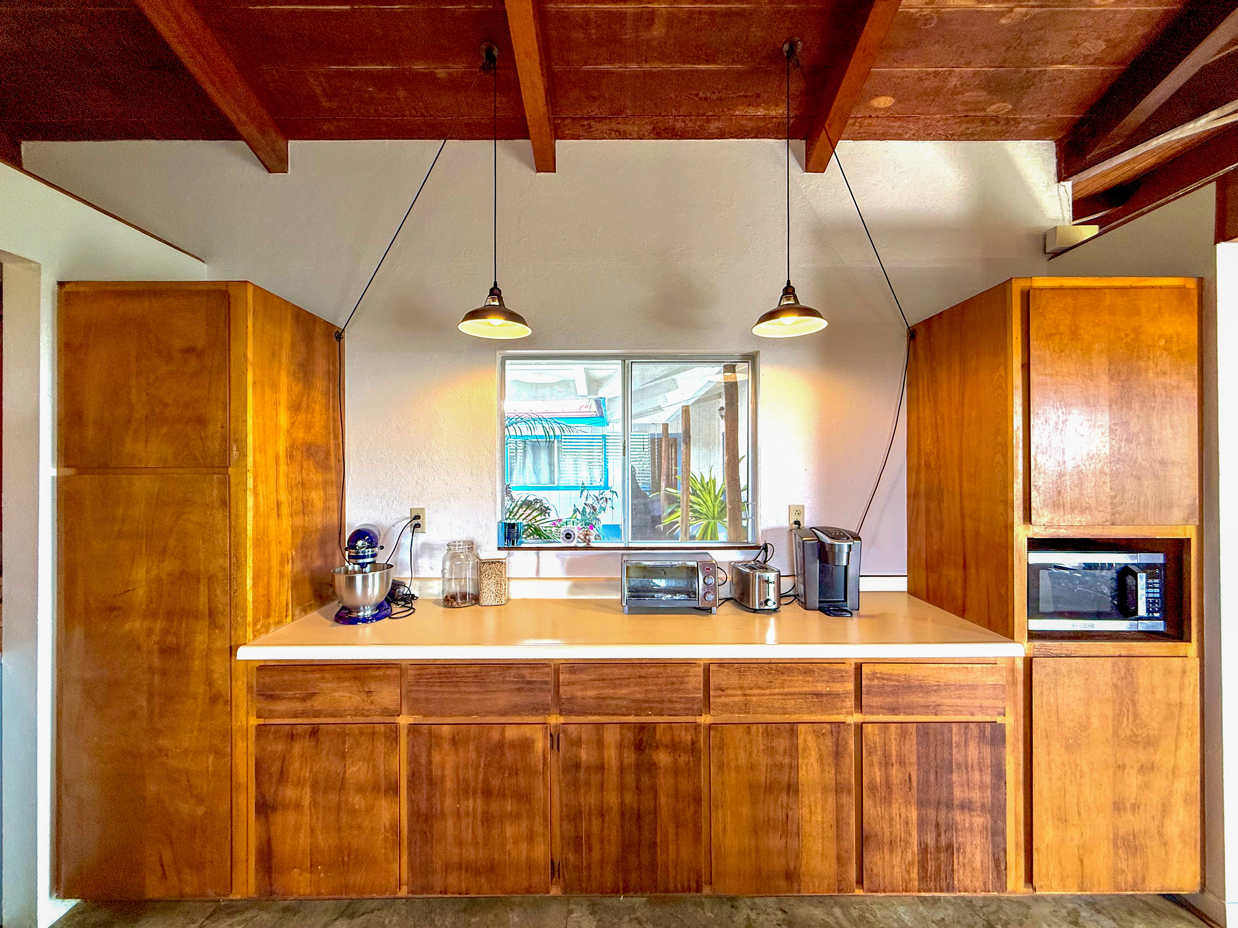 94-1726 Wakea Avenue Naalehu, HI 96772 - Photo 9 of 30 a bathroom with a double vanity sink and a large mirror