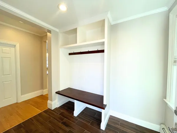 a hallway with wooden floor