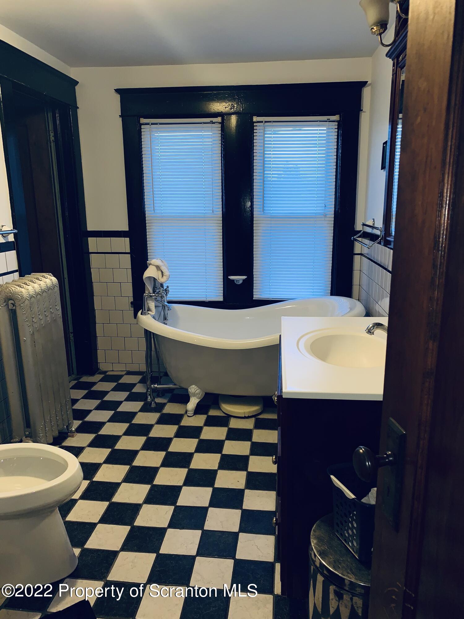 2002 Rigg Street Dunmore, PA 18512 - Photo 22 of 29 a bathroom with a toilet a sink and a mirror