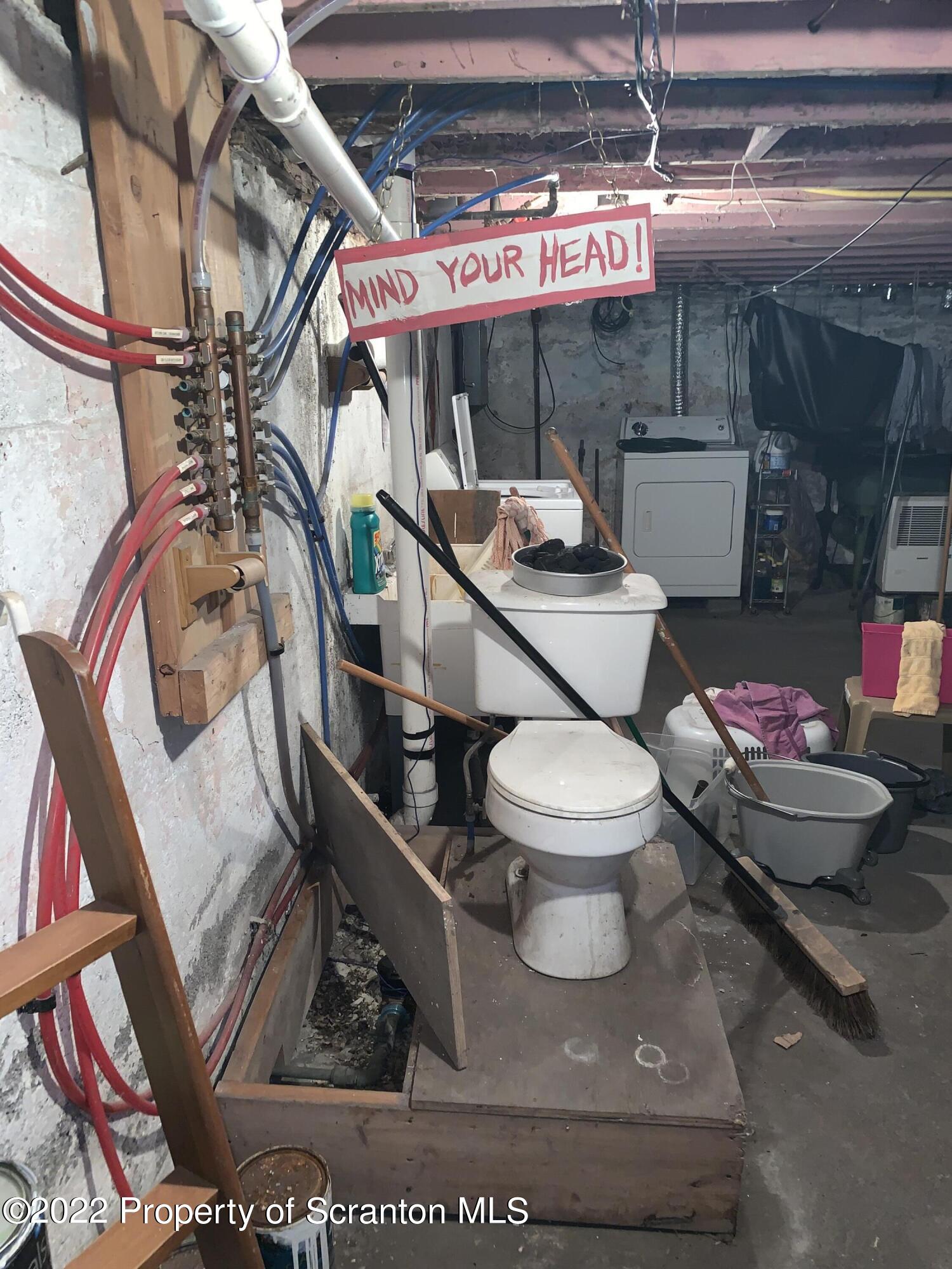 2002 Rigg Street Dunmore, PA 18512 - Photo 23 of 29 a bathroom with a toilet and a mirror