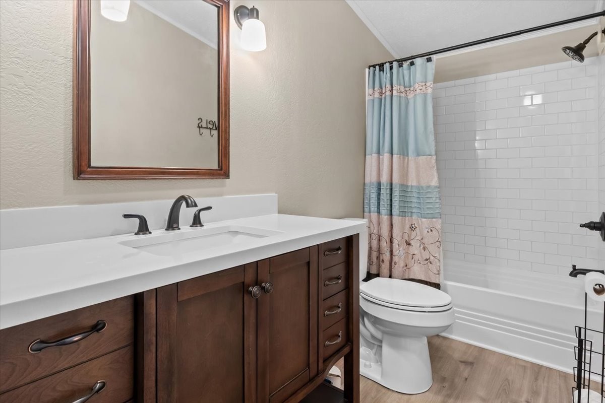 1112 Garners Creek Road Dickson, TN 37055 - Photo 22 of 57 a bathroom with a sink a toilet and shower