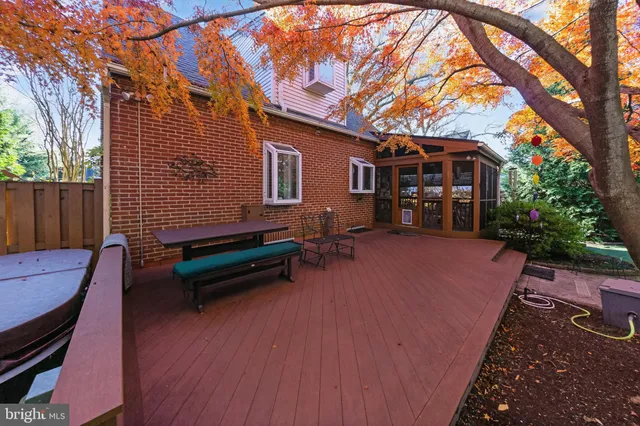 a view of a yard with plants and trees