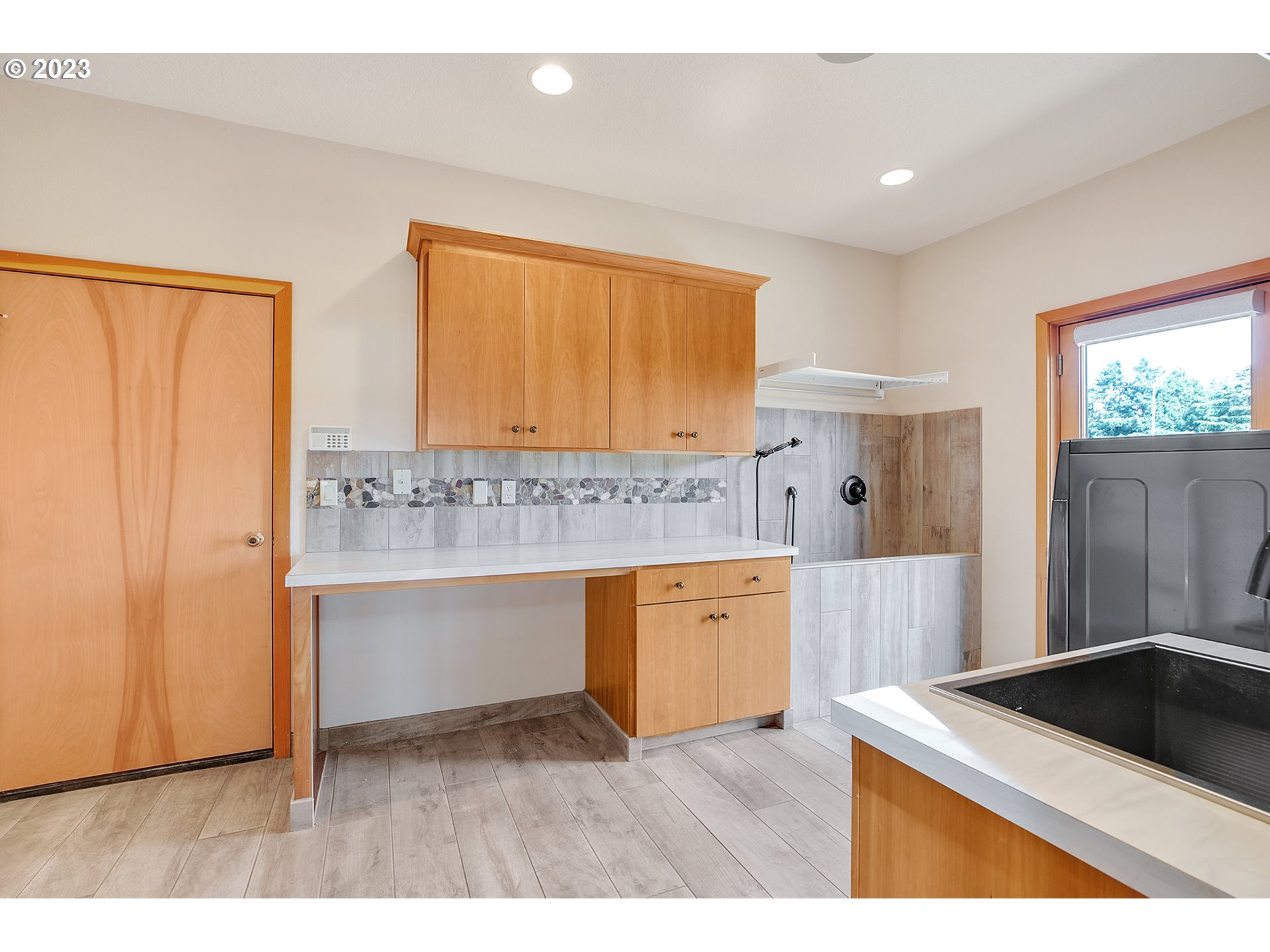 14315 Southwest Westfall Road Sherwood, OR 97140 - Photo 13 of 45 a kitchen with granite countertop a sink cabinets and stainless steel appliances