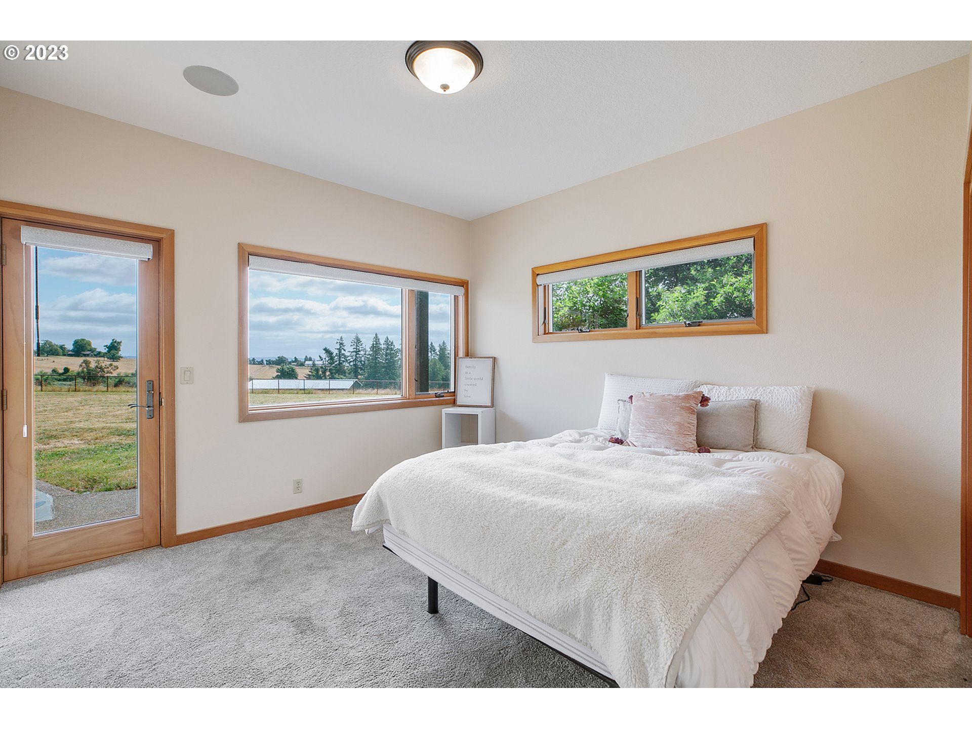 14315 Southwest Westfall Road Sherwood, OR 97140 - Photo 16 of 45 a bedroom with a bed and a painting on the wall
