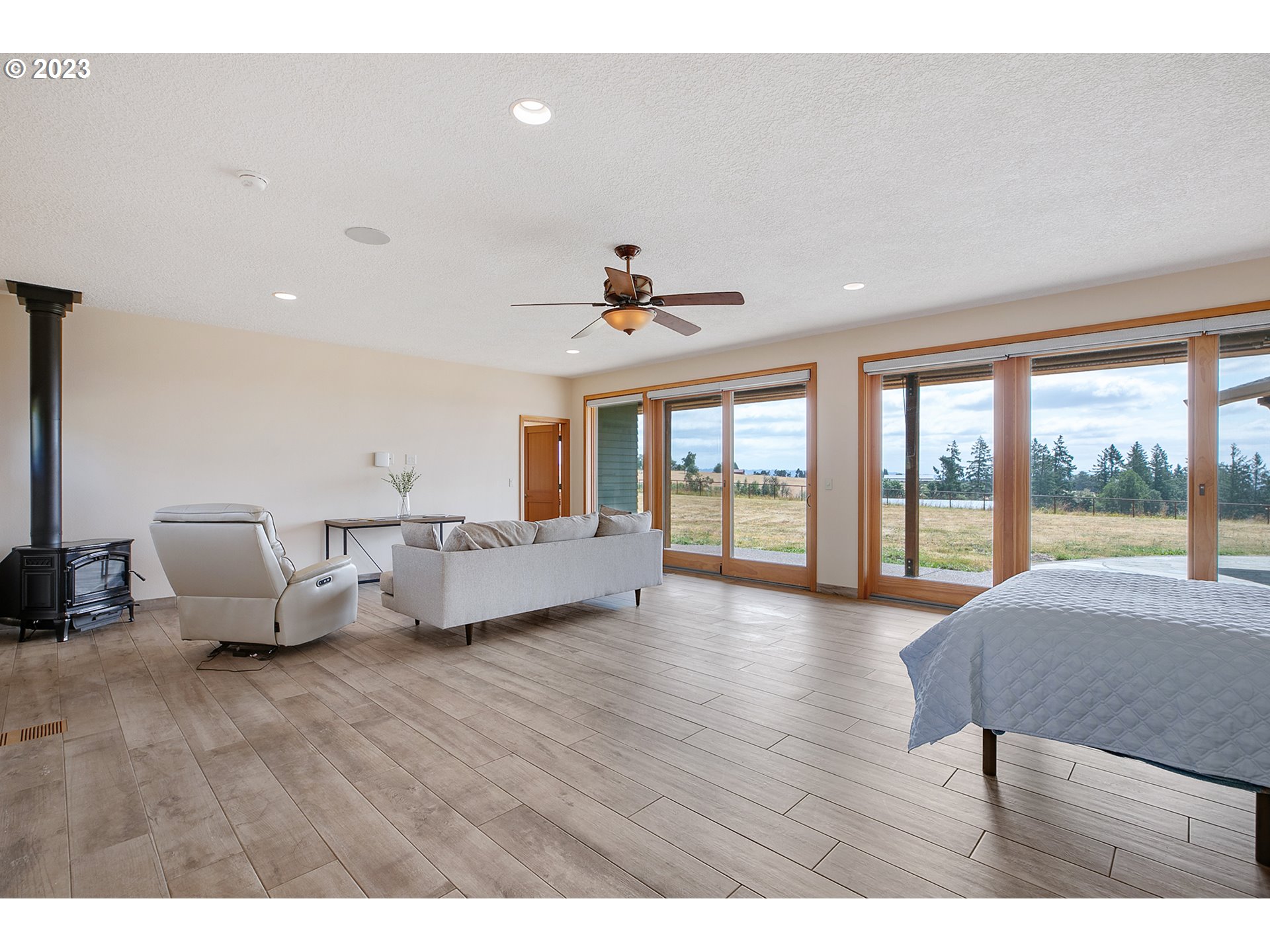 14315 Southwest Westfall Road Sherwood, OR 97140 - Photo 19 of 45 a living room with furniture and a large window