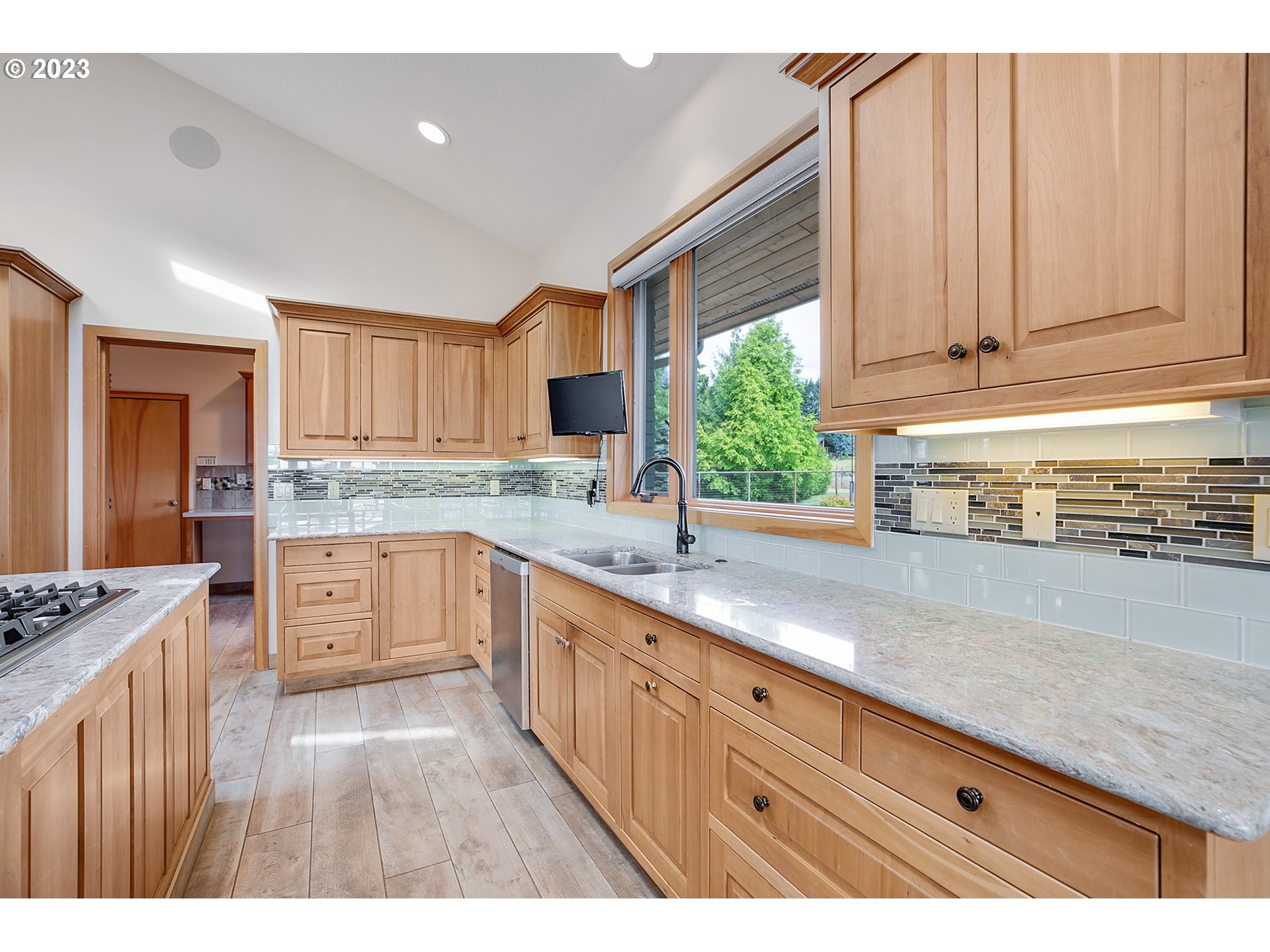 14315 Southwest Westfall Road Sherwood, OR 97140 - Photo 10 of 45 a kitchen with granite countertop a sink stainless steel appliances and cabinets