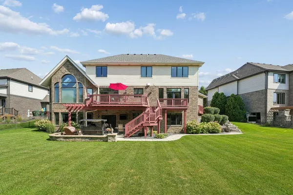 a view of a house with a yard porch and sitting area