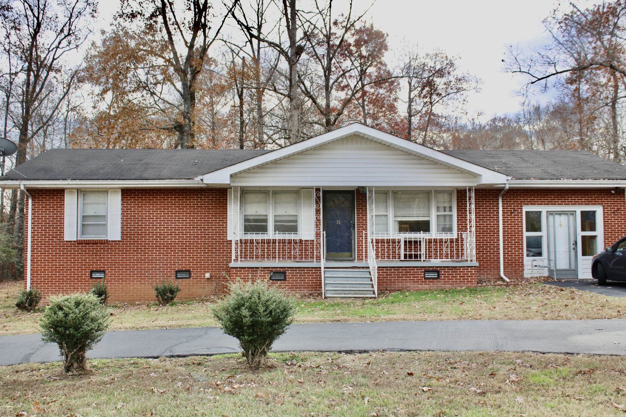 a front view of a house with garden