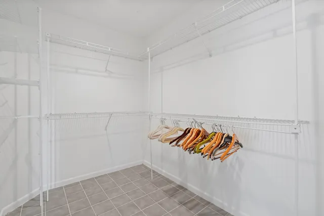 a bathroom with a double vanity sink mirror double and bathtub