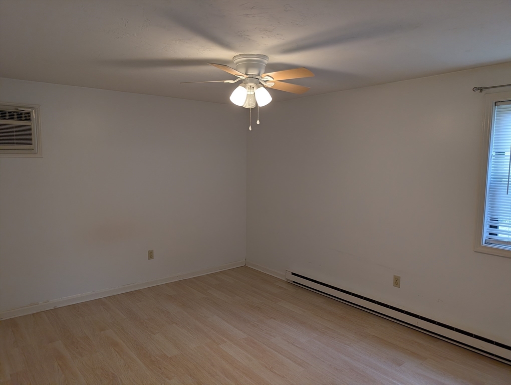 653 Plantation Street, Unit 6A Worcester, MA 01605 - Photo 11 of 14 wooden floor in an empty room