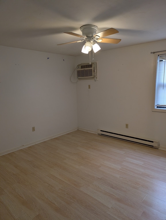 653 Plantation Street, Unit 6A Worcester, MA 01605 - Photo 12 of 14 wooden floor in an empty room