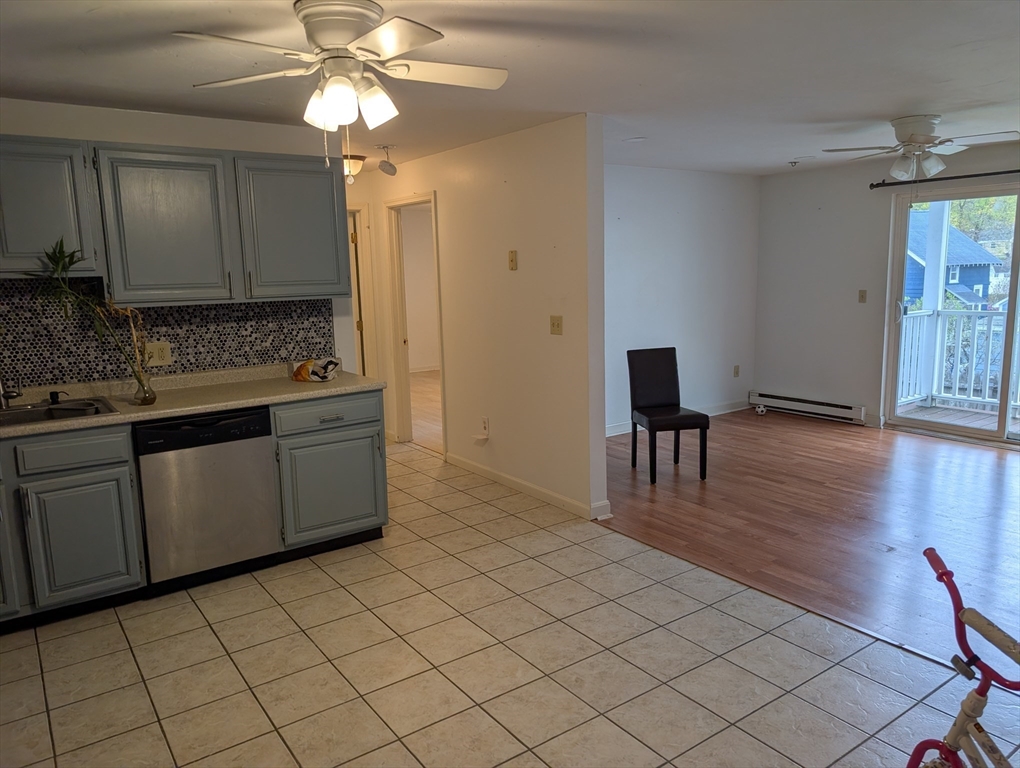 653 Plantation Street, Unit 6A Worcester, MA 01605 - Photo 3 of 14 a kitchen with a sink cabinets and wooden floor