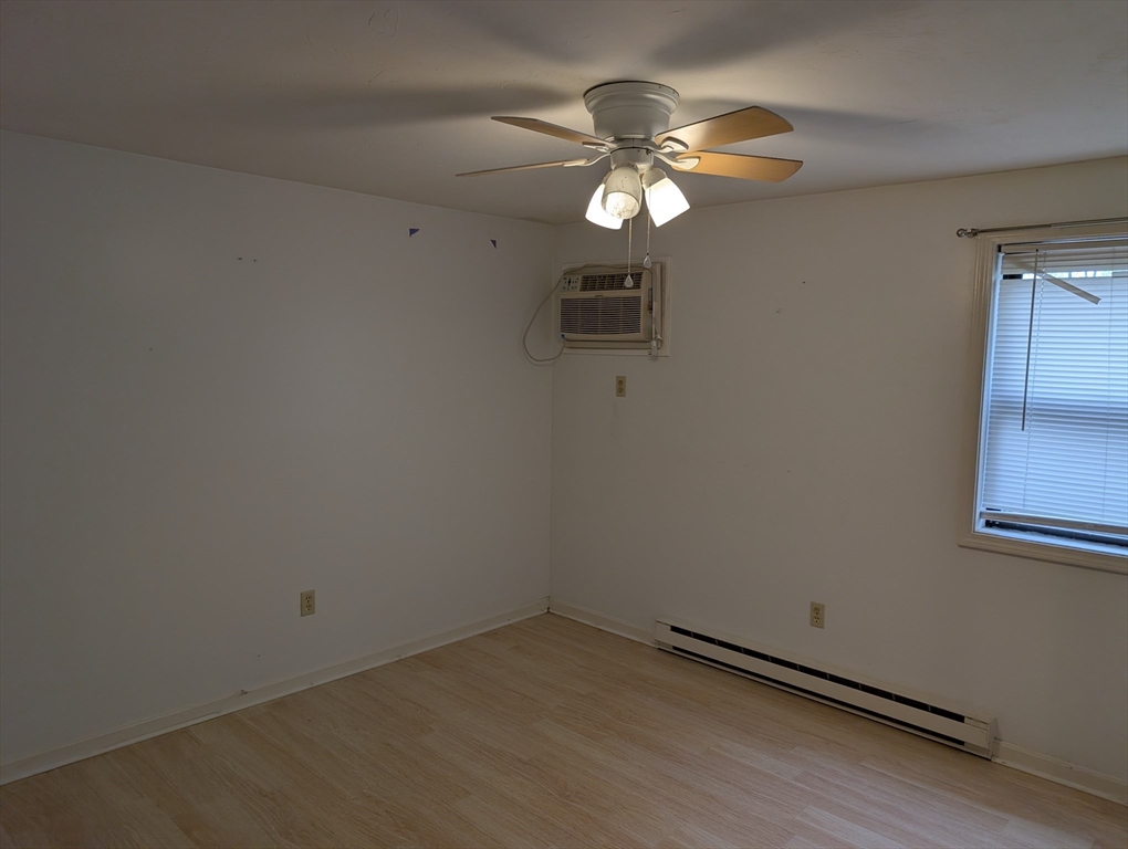 653 Plantation Street, Unit 6A Worcester, MA 01605 - Photo 10 of 14 an empty room with a chandelier fan