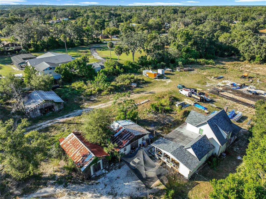 7717 Clarcona Ocoee Road Orlando, FL 32818 - Photo 34 of 63 an aerial view of a house with garden space and lake view